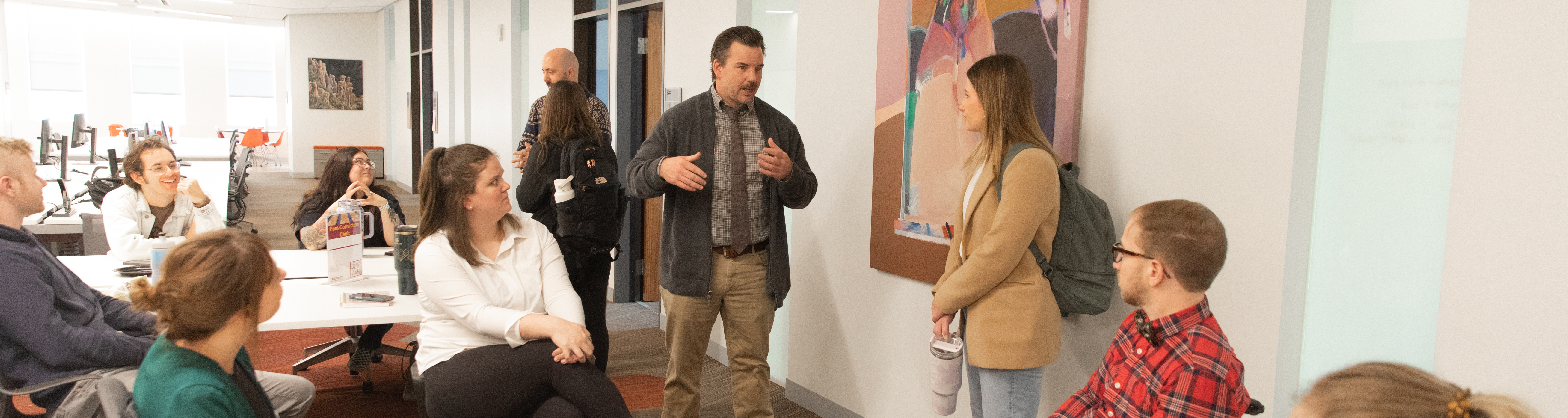 Students talking together with Assistant Dean and Clinical Director, Joey Dormady